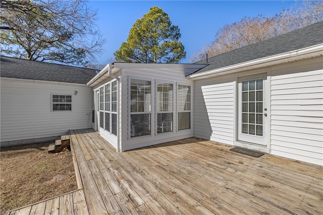 wooden deck featuring a sunroom