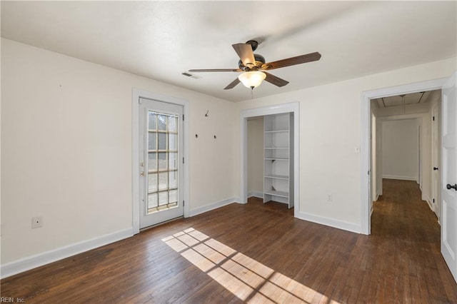 unfurnished bedroom with ceiling fan, a closet, and dark hardwood / wood-style floors