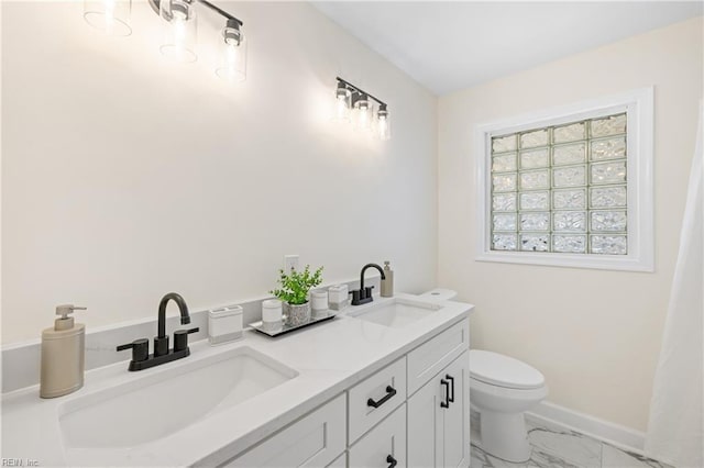 bathroom featuring toilet and vanity