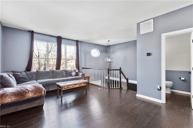 living room featuring dark wood-type flooring