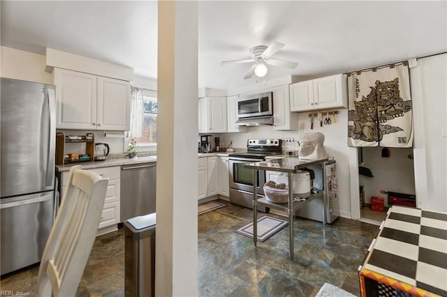 kitchen with white cabinetry, ceiling fan, and appliances with stainless steel finishes