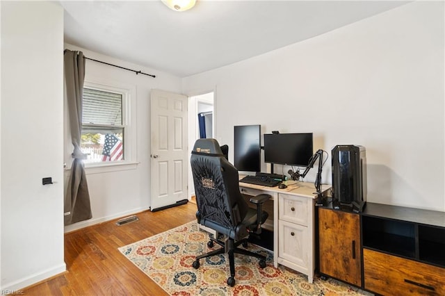 home office featuring light hardwood / wood-style floors