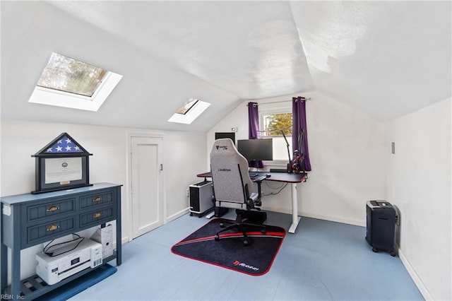 office area featuring lofted ceiling with skylight