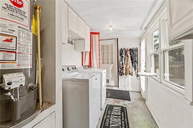 washroom with separate washer and dryer and heating unit