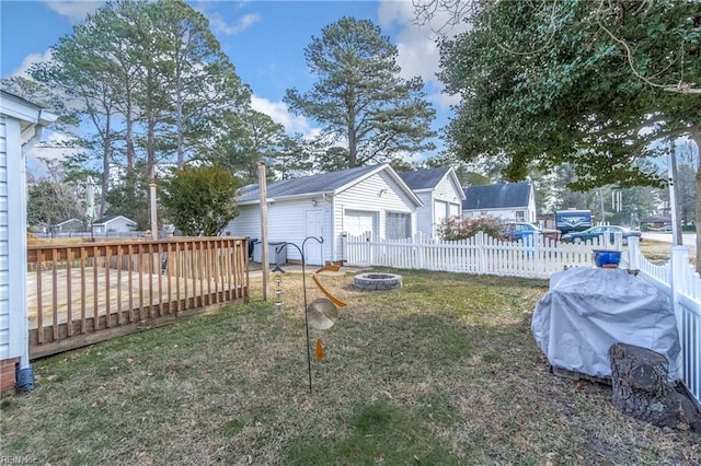 view of yard with a fire pit and a wooden deck