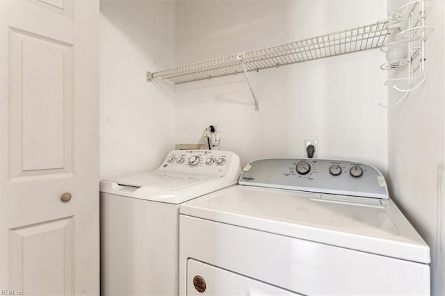 laundry room featuring washer and clothes dryer