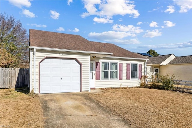 single story home with a front lawn and a garage