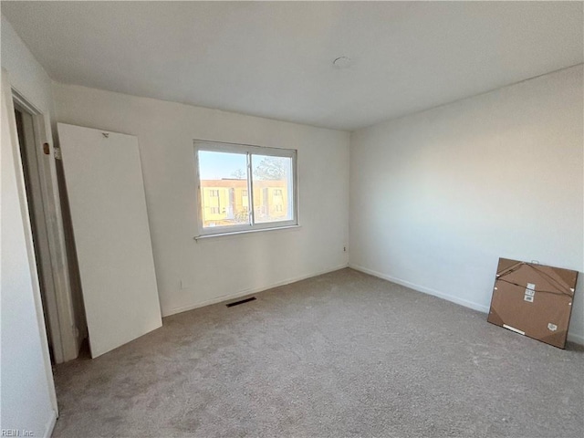 unfurnished bedroom featuring light colored carpet