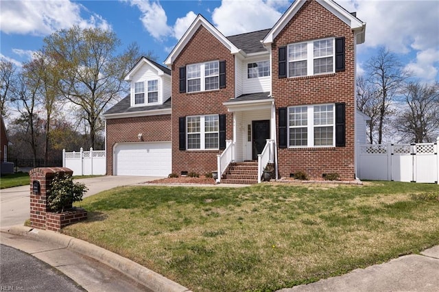 view of front of property with a front yard and a garage