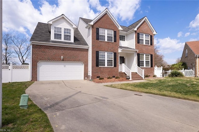 view of front of house with a garage and a front lawn