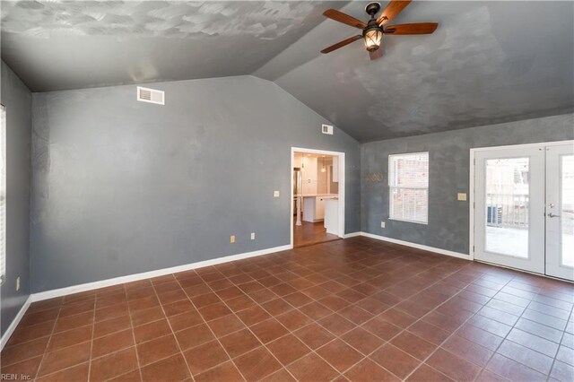 interior space with french doors, ceiling fan, and vaulted ceiling