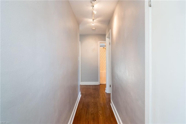 corridor featuring dark wood-type flooring