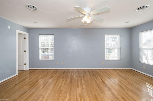 unfurnished room with ceiling fan and light hardwood / wood-style floors