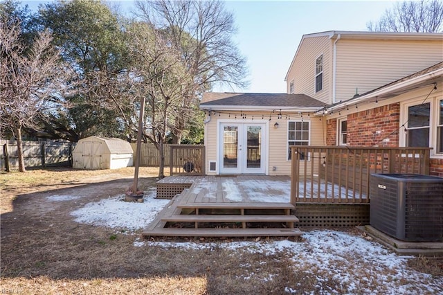 exterior space featuring central AC, french doors, a storage unit, and a wooden deck