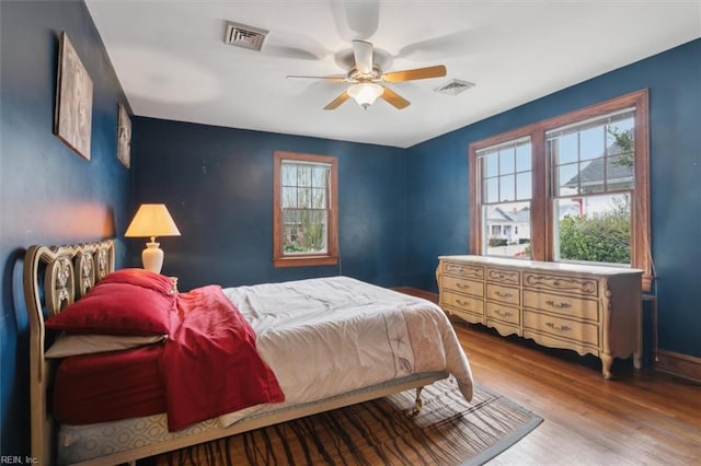 bedroom featuring ceiling fan and light hardwood / wood-style floors