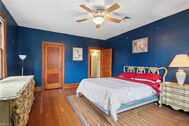 bedroom featuring ceiling fan and wood-type flooring