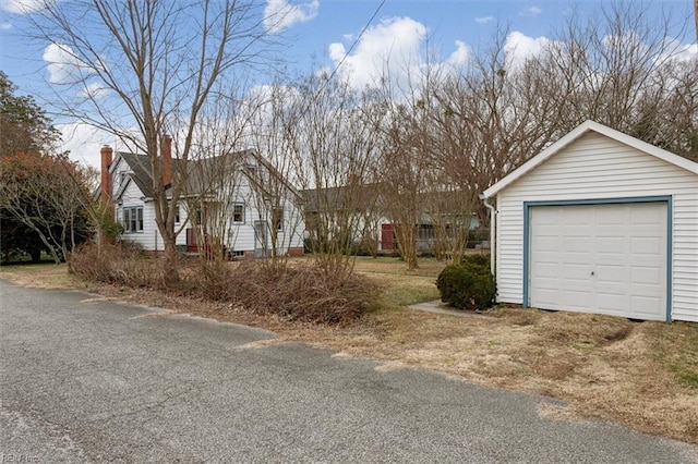 view of front of house featuring an outbuilding and a garage