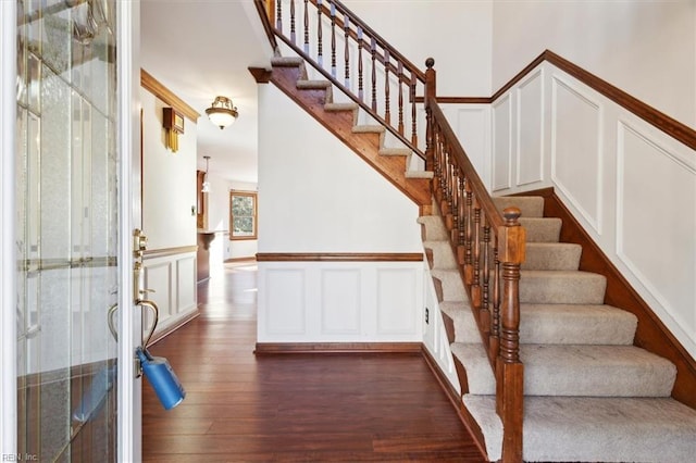 stairway featuring hardwood / wood-style flooring