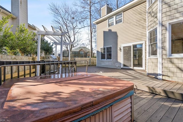 deck featuring a hot tub