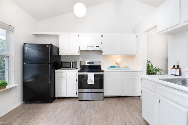 kitchen with stainless steel appliances, white cabinets, and pendant lighting