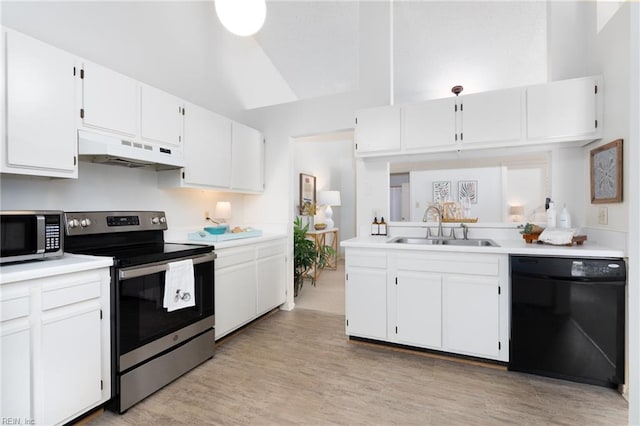 kitchen featuring white cabinets, appliances with stainless steel finishes, light hardwood / wood-style flooring, and sink