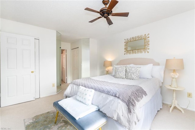 bedroom featuring light carpet and ceiling fan