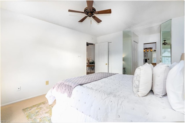 bedroom featuring ceiling fan and carpet flooring