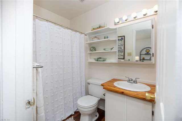 bathroom with walk in shower, vanity, and toilet