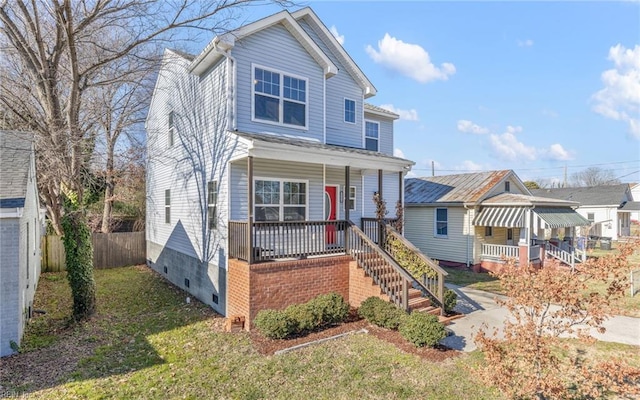 view of front of property with covered porch and a front lawn