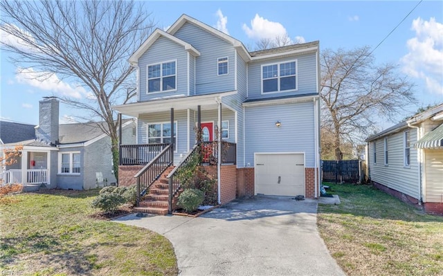 view of front of property featuring a porch, a front lawn, and a garage