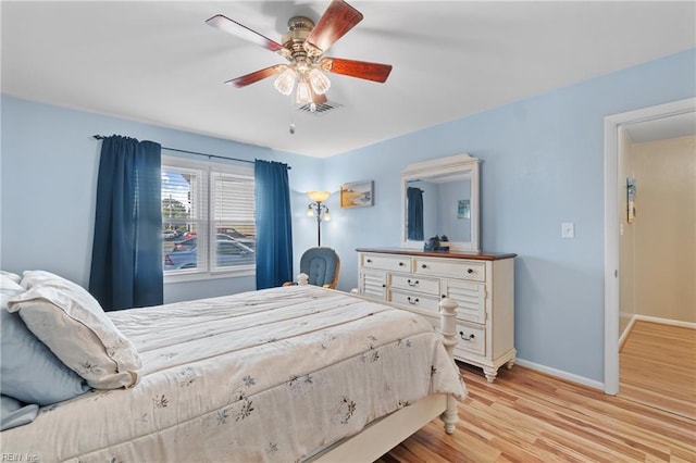 bedroom with ceiling fan and light wood-type flooring