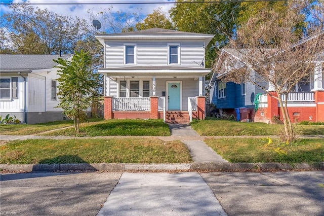 view of front facade featuring a front yard and a porch