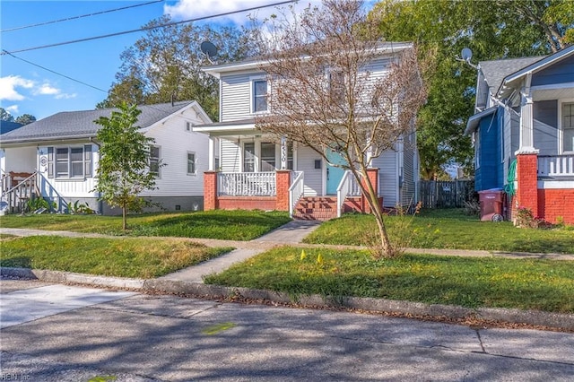 view of front of property with covered porch and a front lawn