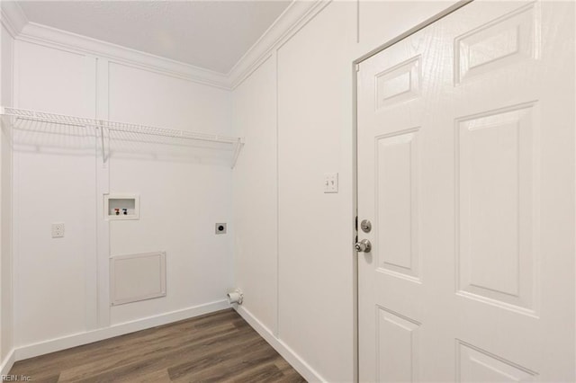 laundry room featuring ornamental molding, dark hardwood / wood-style flooring, hookup for a washing machine, and electric dryer hookup