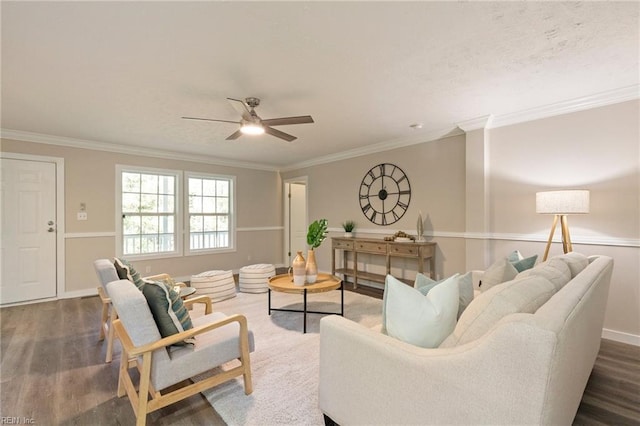 living room with ceiling fan, crown molding, and dark hardwood / wood-style floors