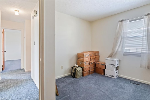 interior space with a healthy amount of sunlight and carpet flooring