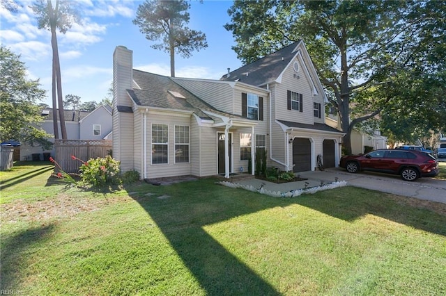 view of front property with a garage and a front lawn