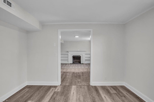 empty room featuring wood-type flooring