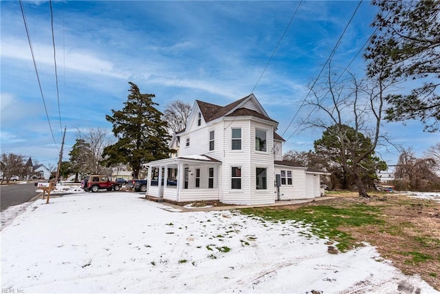 view of snow covered house