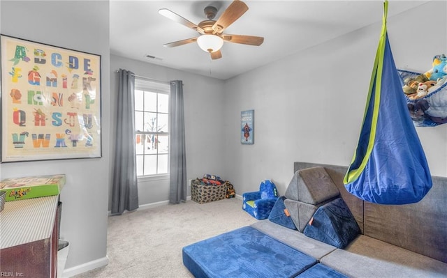 bedroom featuring ceiling fan and light colored carpet