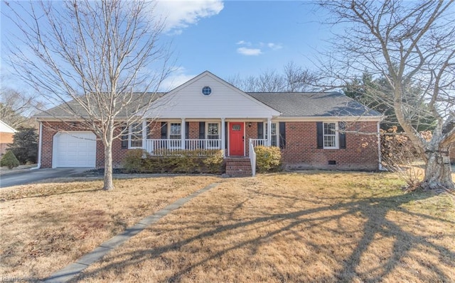 ranch-style home featuring covered porch, a garage, and a front lawn