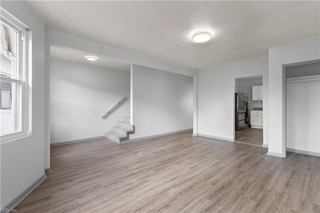 unfurnished living room with light hardwood / wood-style flooring