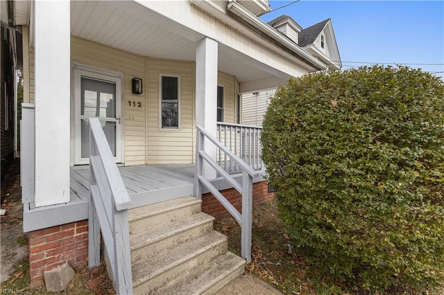 property entrance featuring covered porch