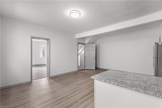 bonus room with light hardwood / wood-style floors