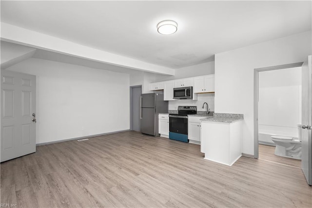 kitchen featuring light hardwood / wood-style floors, sink, white cabinetry, and appliances with stainless steel finishes