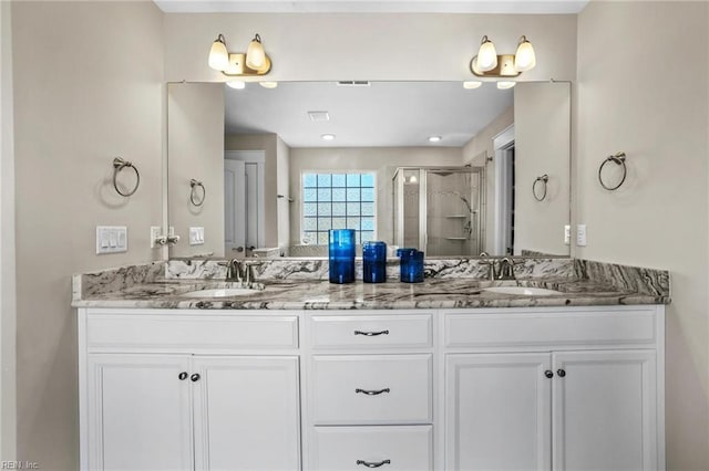 bathroom with vanity and walk in shower