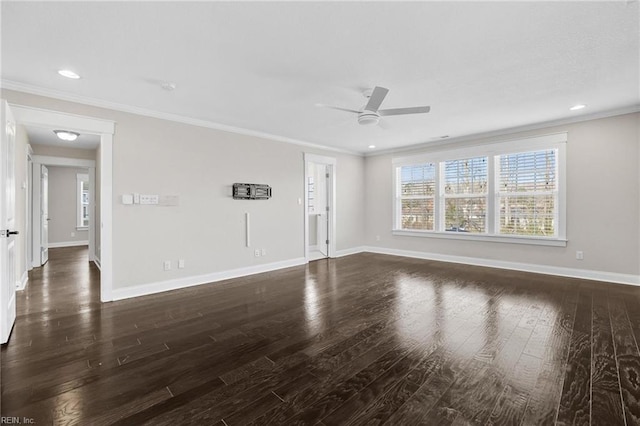 unfurnished room with dark hardwood / wood-style flooring, ornamental molding, and ceiling fan