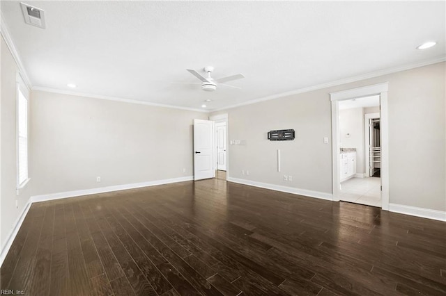 unfurnished room featuring ceiling fan, crown molding, and dark hardwood / wood-style floors