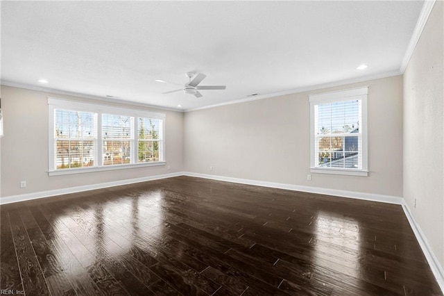 empty room featuring ornamental molding, dark wood-type flooring, and ceiling fan