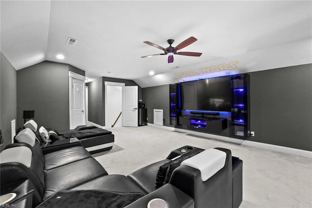 carpeted home theater featuring lofted ceiling and ceiling fan